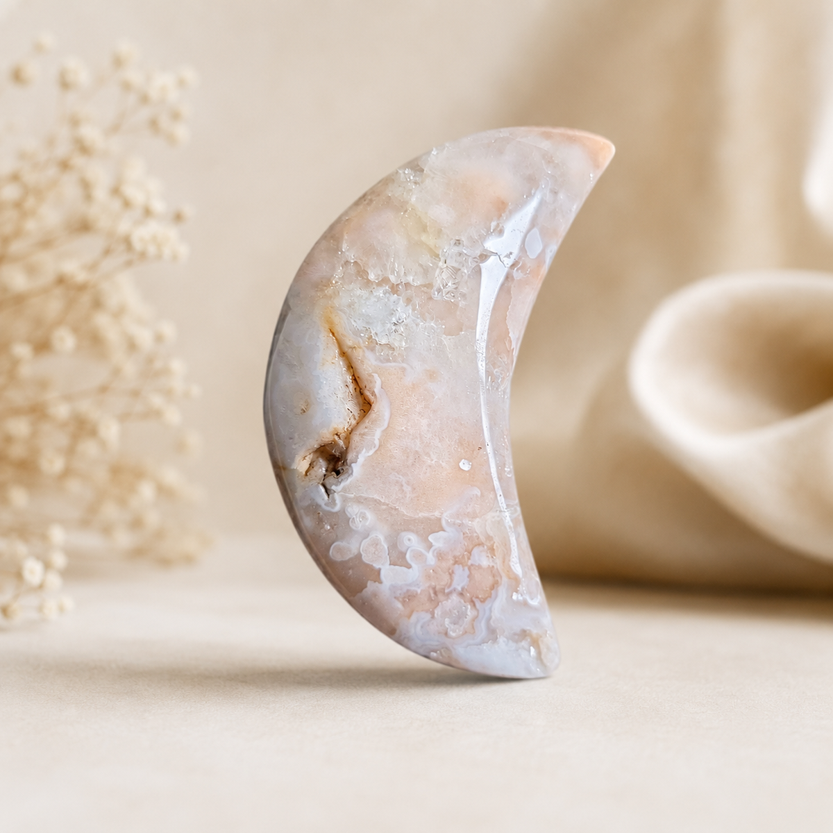 Flower Agate crescent moon crystal carving in blush and cream tones