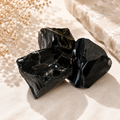 Raw Black Obsidian crystal chunk with deep black glassy texture
