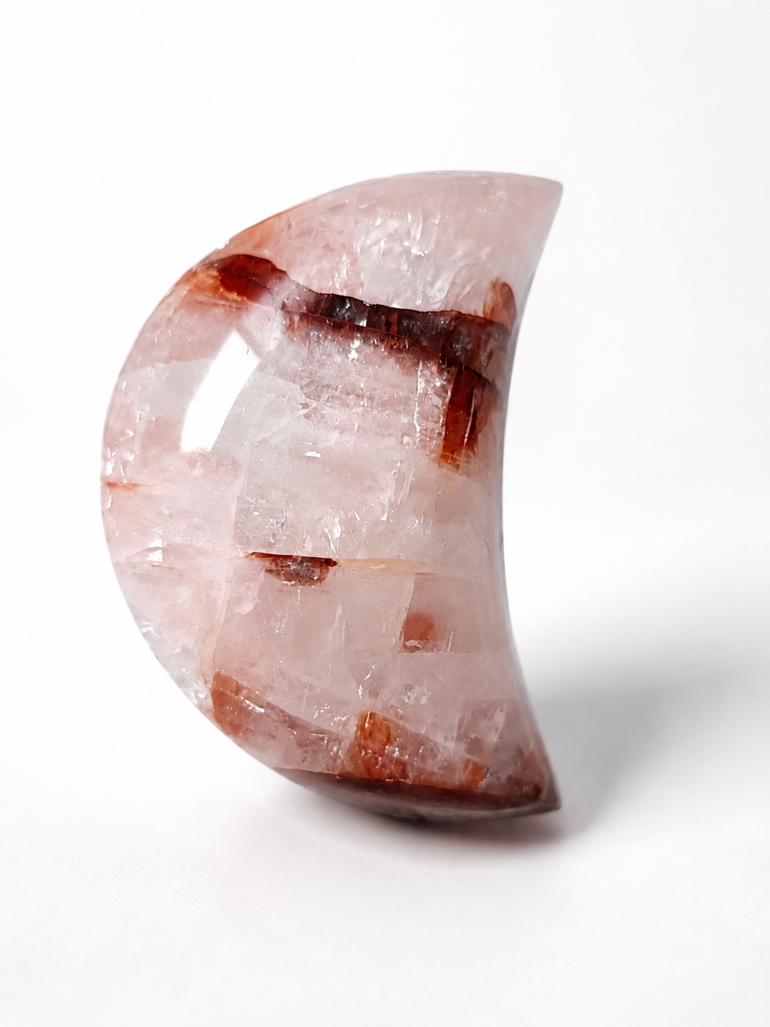 Hematoid Quartz crescent moon crystal carving with deep red inclusions