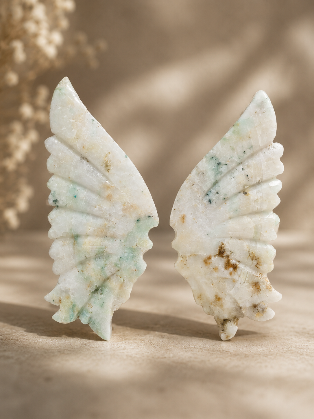 Chrysocolla in Quartz crystal wing carving with aqua-green inclusions