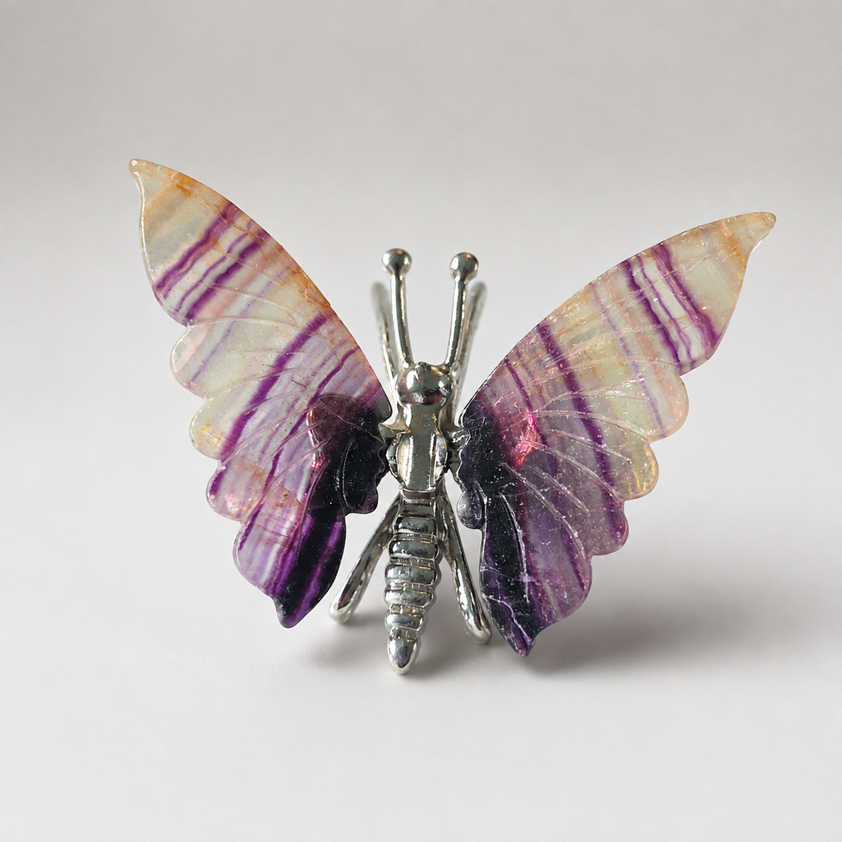 Fluorite butterfly crystal carving with purple banded wings
