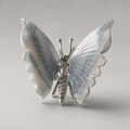 Fluorite butterfly crystal carving with green purple and white banding