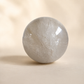 1030g Light Smoky Quartz crystal sphere with translucent grey tones