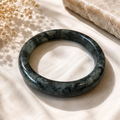 Nephrite Jade polished crystal bangle in deep green tones