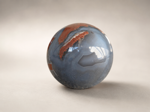 570g Agate crystal sphere with smoky grey and caramel banding