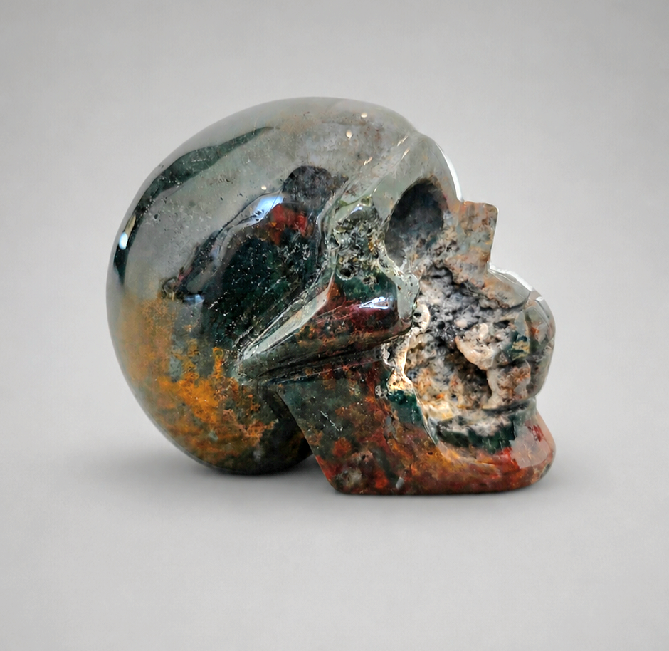 824g Bloodstone skull crystal carving with green and red inclusions