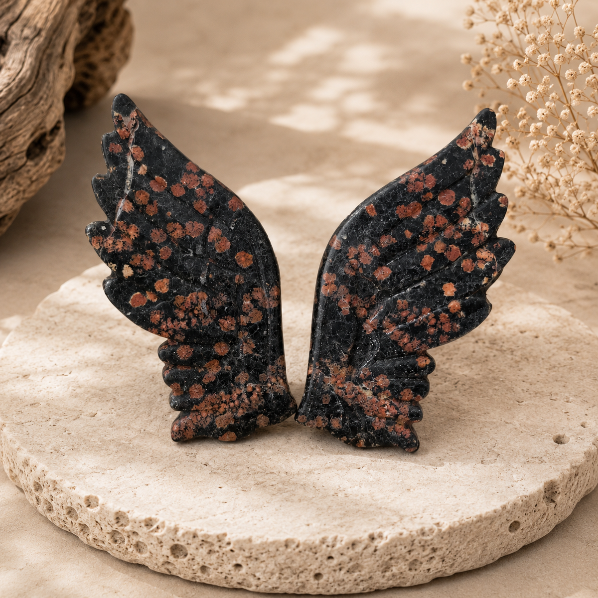 Red Snowflake Obsidian crystal wings with black and rusty red markings