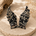 Snowflake Obsidian crystal wings with black and creamy-white markings