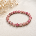 Rhodonite polished bead crystal bracelet in blush and raspberry tones