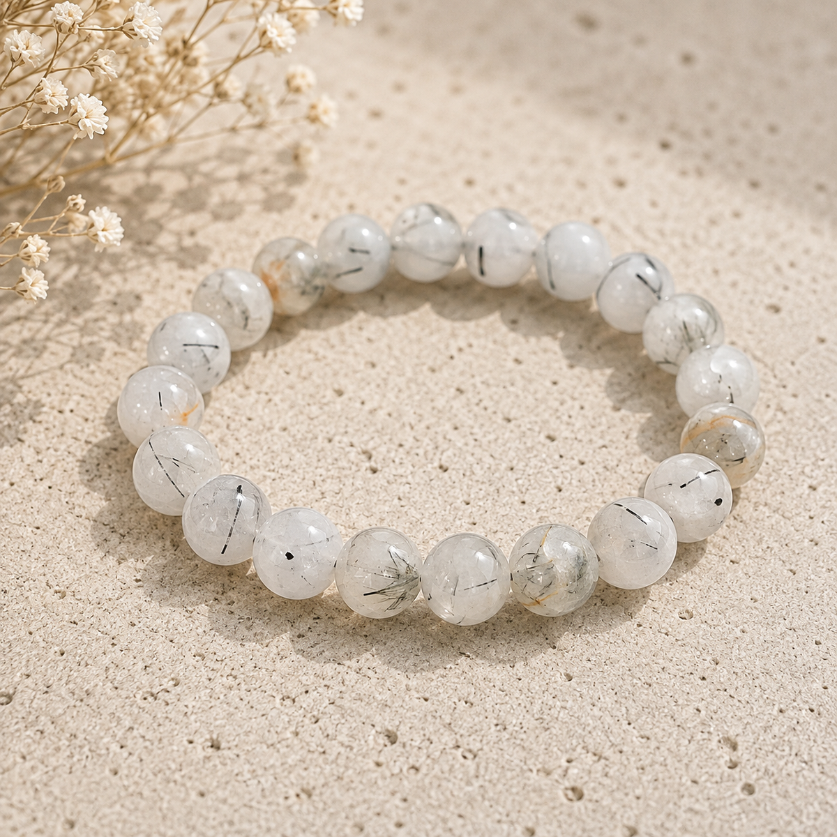 Tourmalinated Quartz crystal bracelet with black tourmaline needle inclusions